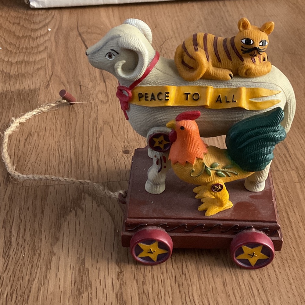 Peace to All Figurine featuring ram, tiger, rooster